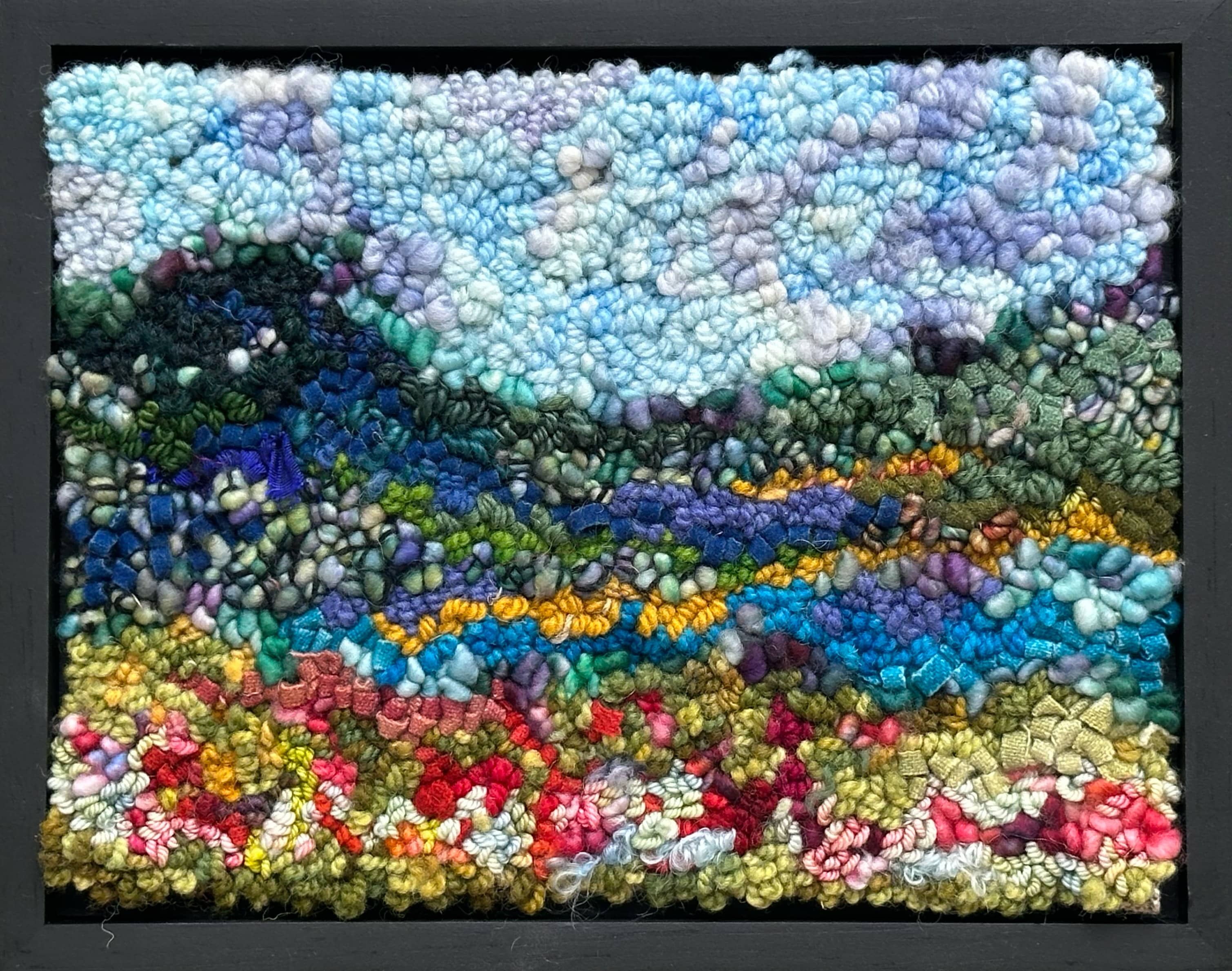 update alt-text with template Red flowers on the blue mountain 12" x 9.5" Framed-Rugs for sale-Deanne Fitzpatrick Rug Hooking Studio-Rug Hooking Kit -Rug Hooking Pattern -Rug Hooking -Deanne Fitzpatrick Rug Hooking Studio -Is rug hooking the same as punch needle?
